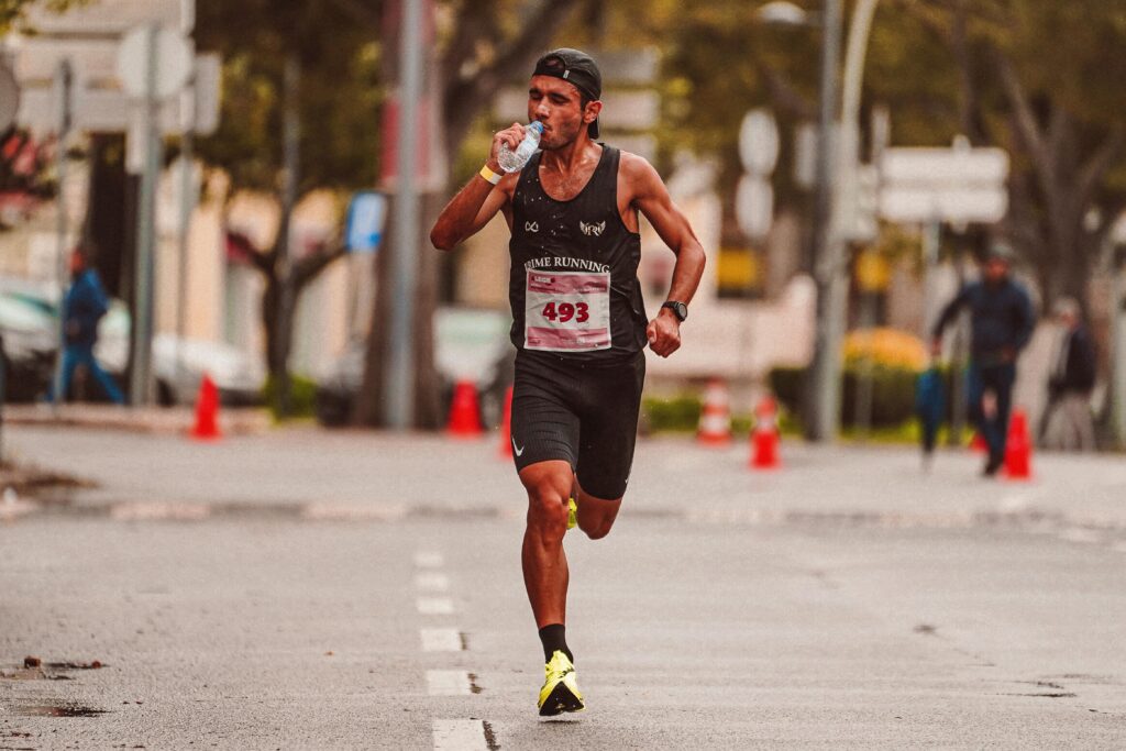 Runner drinking water